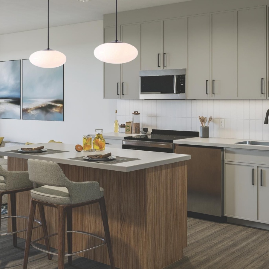 a kitchen with grey cabinets